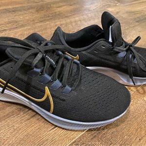 Nike Pegasus black with gold trim. Gently used.